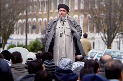  ?? PHOTO: GETTY IMAGES ?? Hate: now convicted preacher Abu Hamza al-Masri addresses followers outside Finsbury Park mosque