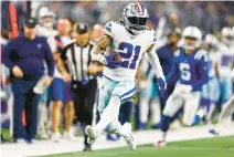  ?? BRANDON WADE/AP ?? Dallas Cowboys running back Ezekiel Elliott finished with fewer than 900 rushing yards (876) in the regular season for the first time in his career.