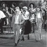  ?? ANGELA WEISS/GETTY-AFP ?? Designer Tommy Hilfiger, left, and Zendaya, right, walk the outdoor runway at the Apollo Theater on Sunday.