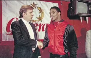  ?? Dave Pickoff Associated Press ?? HERSCHEL Walker with Donald Trump in 1984. The former football player should have read up on the Black Lives Matter movement before releasing a video rejecting it.