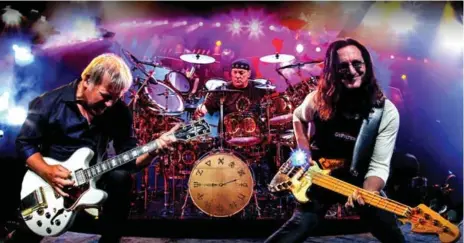  ?? RANDY JOHNSON ?? Guitarist Alex Lifeson, left, drummer Neil Peart and bassist/singer Geddy Lee on stage during Rush’s 2012 Clockwork Angels tour.