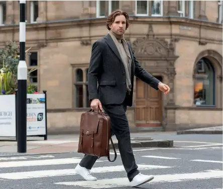  ??  ?? Left: Fox flannel grey twopiece suit £1,800; Beige cashmere rollneck £255.