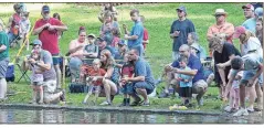  ?? / Steven Eckhoff. ?? A good crowd fishes Saturday during TU Kids Fishing Day at Rolater Park.