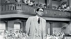  ?? AP ?? Gregory Peck is shown as attorney Atticus Finch, a small-town Southern lawyer who defends a black man accused of rape, in a scene from the 1962 movie To Kill a Mockingbir­d.