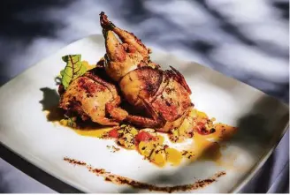  ?? Nick de la Torre ?? Codorniz Encamisada at Hugo’s is two bacon-wrapped quail stuffed with chorizo and quinoa.