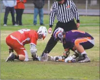  ??  ?? Glen Burnie senior Chad Albrecht, left, and McDonough senior Billy Edge battle for a face-off in the first half of Saturday’s boys lacrosse tournament contest at Thomas Stone. Glen Burnie won the contest 18-2.