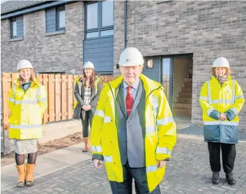  ?? ?? New homes George Paul joined council officers and staff from Springfiel­d Partnershi­ps for a site visit