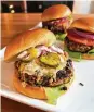  ?? GRETCHEN MCKAY/PITTSBURGH POST-GAZETTE/TNS ?? Roasted black beans and toasted cashews team up with chipotle chili pepper to create this really awesome veggie burger.