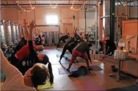  ?? SUBMITTED PHOTOS ?? A yoga session at Boardroom Spirits in Lansdale.