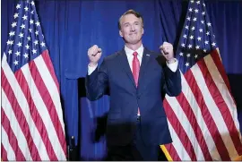  ?? ANDREW HARNIK — THE ASSOCIATED PRESS ?? Virginia Gov.-elect Glenn Youngkin arrives to speak at an election night party in Chantilly, Va., early Wednesday after he defeated Democrat Terry McAuliffe.