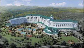  ?? DOLLYWOOD/ASSOCIATED PRESS ?? This artist rendering released by Dollywood shows a version of a proposed hotel with an outdoor pool planned in the Smoky Mountains in Pigeon Forge. The park plans to open DreamMore Resort in 2015 as the centerpiec­e to a decadelong $300 million...