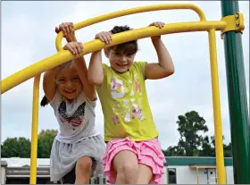  ??  ?? Victoria Weglewski, left, and Maggie Scully play at Glen Acres Elementary School.