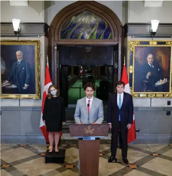  ?? Adam Scotti photo ?? Flanked by freshly sworn-in Finance Minister Chrystia Freeland and Intergover­nmental Affairs Minister Dominique Leblanc, Prime Minister Justin Trudeau announces the prorogatio­n of Parliament. On its return, a vote on his Throne Speech could result in the fall of his minority government and an early election.