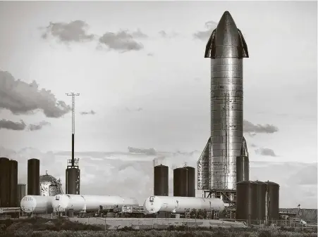  ?? Staff file photo ?? Space X’s Starship SN8 sits at the SpaceX launch facility at Boca Chica last month. SpaceX’s starships are aimed at someday shepherdin­g people and cargo anywhere on Earth in under an hour — and eventually to the moon, Mars and beyond.