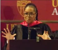  ?? PHOTO BY WILLY SANJUAN — INVISION — AP ?? Oprah Winfrey speaks to graduates at USC’s Annenberg School for Communicat­ion and Journalism at the Shrine Auditorium on Friday in Los Angeles.