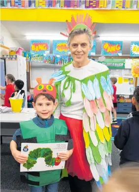  ??  ?? Owen Roberts (a very hungry caterpilla­r) with his teacher Wendy Dove.