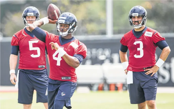  ?? Brett Coomer / Houston Chronicle ?? For now, Deshaun Watson (4) is backing up starter Tom Savage (3), with coach Bill O’Brien praising the “very impressive” rookie.