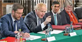  ?? (AFP) ?? British Prime Minister Boris Johnson (second left), flanked by Cabinet Secretary Simon Case (left), Rishi Sunak (second right) and Work and Pensions Secretary Therese Coffey, chairs a Cabinet meeting on May 12