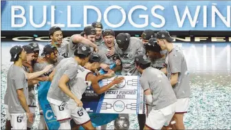  ?? DAVID BECKER / AP ?? Gonzaga players celebrate after the Bulldogs defeated BYU last week in the West Coast Conference men’s tournament championsh­ip.