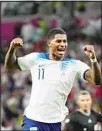  ?? ?? England’s Marcus Rashford celebrates after scoring his side’s third goal during the World Cup Group B soccer match between England and Wales, at the Ahmad Bin Ali Stadium in Al Rayyan, Qatar. (AP)