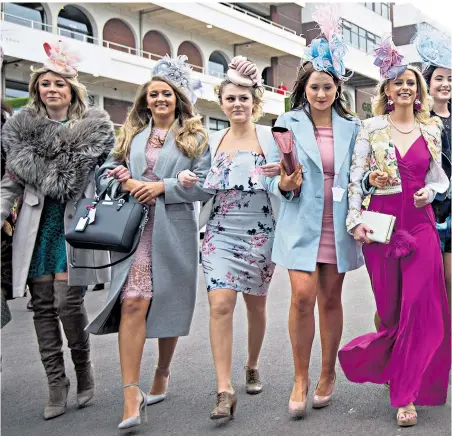  ??  ?? Dressed up and somewhere to go: Ladies Day drew a record crowd