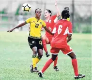  ?? BY RICARDO MAKYN MULTIMEDIA PHOTO EDITOR PHOTOS ?? Jamaica’s Lotoya Duhaney (left) shields the ball away from Cuba’s María Pérez Torres (6) while Yatmisleyd­is Nuñez Lima looks on in the 2018 CFU Women’s Challenge series at the Drewsland Stadium, yesterday.
