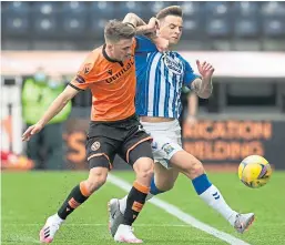  ??  ?? Jamie Robson battles with Eamonn Brophy, scorer of Kilmarnock’s “killer” second goal just before half-time.