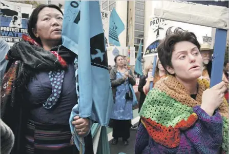  ?? Santiago Mejia San Francisco Chronicle ?? TSERING YANGKEY, left, of Tibet, and Tanya Fromberg, of London, protest the Dakota Access oil pipeline in San Francisco.