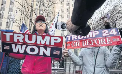  ?? BLOOMBERG ?? Supporters of former US President Donald Trump speak to members of the media during a rally outside the New York County Criminal Court in New York on Monday.