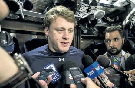  ?? CRAIG ROBERTSON/POSTMEDIA NETWORK ?? Sporting some nicks and bruises, Toronto Maple Leafs defenceman Morgan Rielly spoke to the media on locker clean-out day at the Air Canada Centre in Toronto. Rielly said he is open to playing for Team Canada at the world championsh­ips.