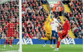  ?? AP ?? Spurs goalkeeper Hugo Lloris makes a save on Mohamed Salah’s shot during his side’s draw with Liverpool.