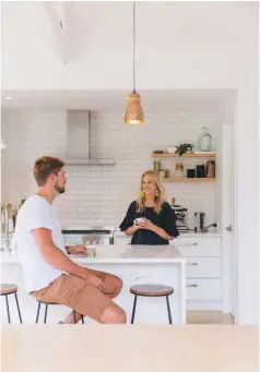  ??  ?? ABOVE LEFT Clare and Simon like to linger in the kitchen over coffee in the mornings. ABOVE RIGHT The dining table is treasured for its sentimenta­l value – it once belonged to Clare’s mother. Clare has teamed it with vintage chairs found on Trade Me...