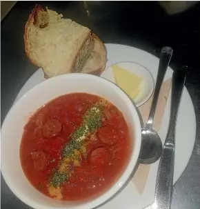  ??  ?? Warm up on a cold and miserable winter’s day with this tomato and chorizo soup from Kaka Cafe.