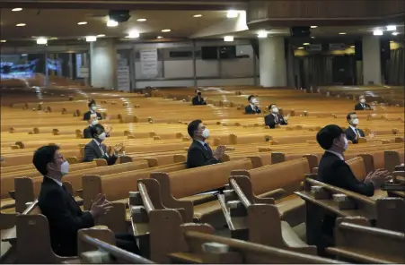  ?? (AP PHOTO/AHN YOUNG-JOON) ?? Pastors wearing face masks attend a service at the Yoido Full Gospel Church in Seoul, South Korea, March 15, 2020.