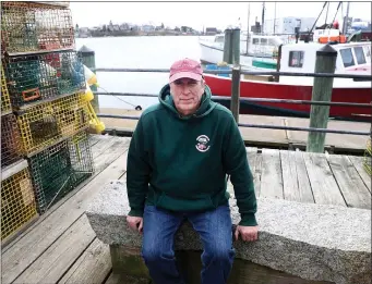  ?? NANCY LANE — BOSTON HERALD ?? Arthur Sawyer, president of the Massachuse­tts Lobstermen’s Associatio­n, on the docks in Gloucester on Wednesday.
