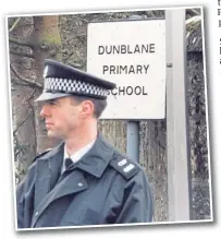  ??  ?? An upset policeman outside the school