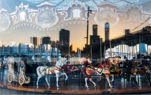  ??  ?? Top: Manhattan skyline reflecting in a window with a carousel. Not being tied to convention­s will help you create imagery that can’t be found anywhere else. Above left: Jordan spotted this unusual entrance to a shopping mall in Tokyo and just had to photograph it. It’s not hard to see why, with the fun reflection­s and angles bouncing around playfully.