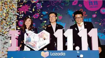  ?? PIC BY AZIAH AZMEE ?? Lazada Malaysia chief executive officer Leo Chow (centre) with chief business officer Kevin Lee (right) and chief marketing officer Diana Boo at the launch of Lazada’s 11.11 Shopping Festival in Kuala Lumpur yesterday.