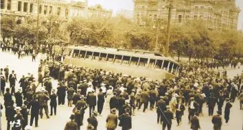  ?? FILES ?? Strikers overturnin­g a streetcar became an emblematic image of the Winnipeg General Strike of 1919. At its strongest point, 35,000 of the total population of 190,000 walked off the job, grinding the city to a halt.