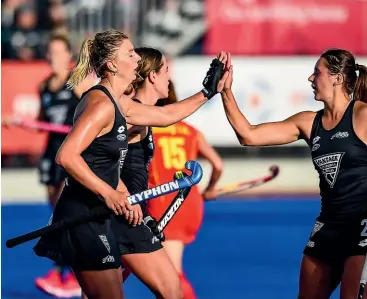  ?? PHOTOSPORT ?? Black Sticks striker Olivia Merry celebrates scoring a goal on her way to reaching the most goals scored by a New Zealand player at North Shore yesterday. She netted four times in the Black Sticks 4-0 win against Belgium.