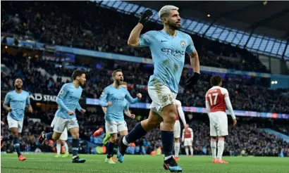  ?? AFP ?? Sergio Aguero celebrates after scoring a goal against Arsenal during a Premier League match at the Etihad Stadium. —