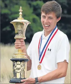  ??  ?? n A delighted Matthew Fitzpatric­k with the US Amateur trophy.