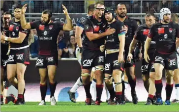  ?? JEAN-PHILIPPE KSIAZEK/AFP ?? Lyon’s players celebrate after scoring during the French Top 14 rugby union match against Montpellie­r on Saturday at the Matmut Stadium de Gerland in Lyon.