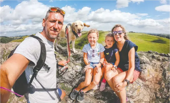  ?? JOHN HIBBS/HANDOUT VIA REUTERS ?? John Hibbs hopes to teach his daughter Xanthe, 6, financial literacy skills by giving her a new children's debit card from U.K. digital bank Starling. His family is pictured. Startups are banking on the growing spending power of teens and children by touting what they say are better, slicker apps to tech-savvy kids and teenagers.