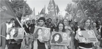  ?? ASSOCIATED PRESS ?? Protesters carrying pictures of people killed in Saturday’s bombing attacks, walk during a march in Ankara, Turkey.