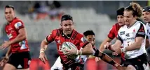  ?? AP ?? Crusaders first-five Mike Delany makes a break against the Sunwolves in Christchur­ch last night.