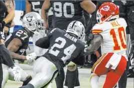  ?? Heidi Fang Las Vegas Review-journal @Heidi Fang ?? Las Vegas Raiders safety Johnathan Abram lowers his shoulder to tackle Kansas City Chiefs wide receiver Tyreek Hill as Hill heads out of bounds Nov. 22.