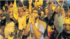  ?? REUTERS ?? Supporters of Mr Solih celebrate on the streets of Male.