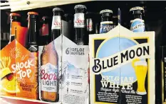  ?? JUSTIN SULLIVAN / GETTY IMAGES ?? Bottles of Coors beer are displayed on a shelf at a liquor store in Fairfax, California. Molson Coors Brewing Co. reported first quarter earnings that fell short of analyst expectatio­ns.