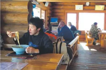  ??  ?? Skiers break for lunch at the lodge atop Charmant Hiuchi, near Itoigawa, Japan. Ramen with fresh vegetables, meat and seafood is a staple on lunch menus here. John Briley, The Washington Post